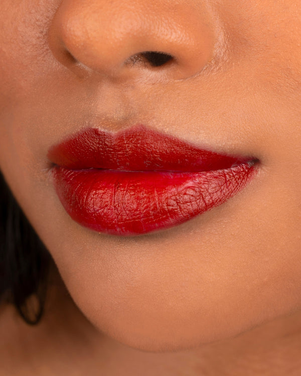 Close-up of lips wearing Ohana&K Vegan and Cruelty-Free Matte Lipstick in Koi, showcasing vibrant color and a comfortable matte finish.