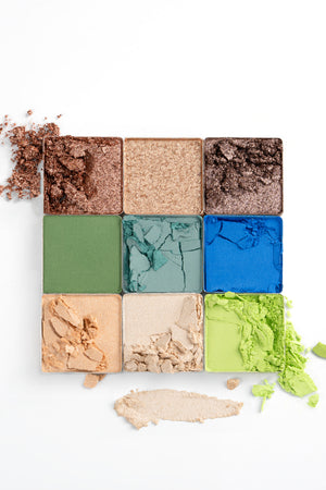 Textures of Ohana&K Vegan and Cruelty-Free Cosmic Nights Palette, showcasing rich blues, shimmering golds, and lush greens for seamless blending and bold looks.