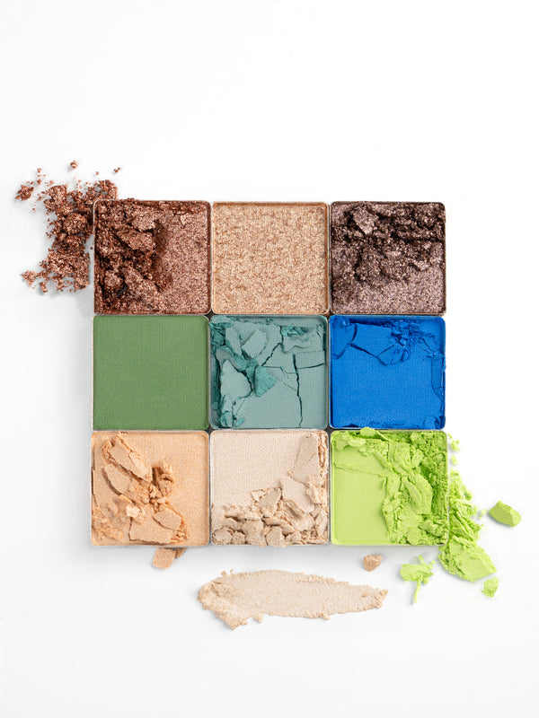 Textures of Ohana&K Vegan and Cruelty-Free Cosmic Nights Palette, showcasing rich blues, shimmering golds, and lush greens for seamless blending and bold looks.